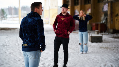 three people wearing a velvet hoodie.